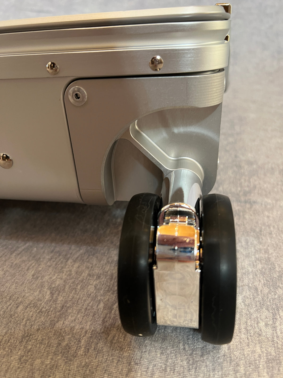 Dual wheel luggage castor assembly for 4-wheel stand up roll aboards.
