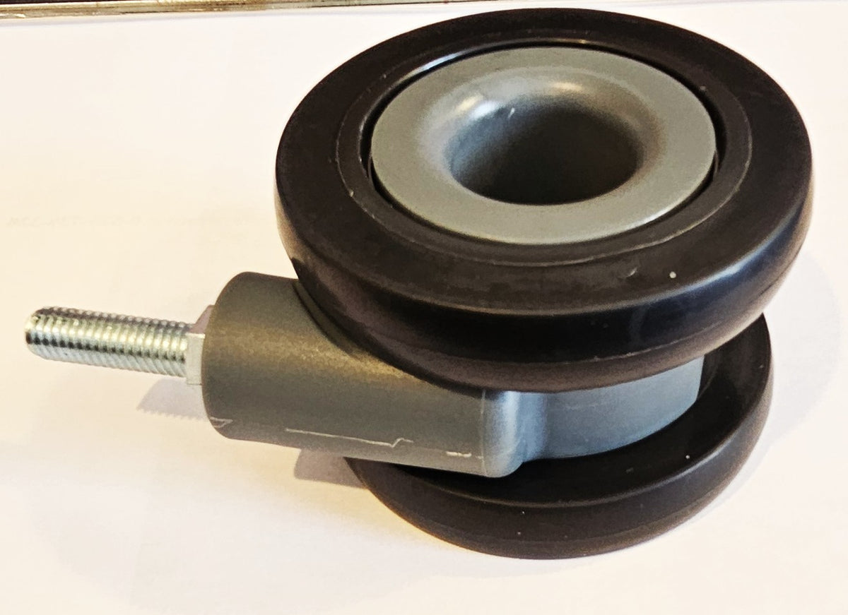 Dual wheel luggage castor assembly for 4-wheel stand up roll aboards.