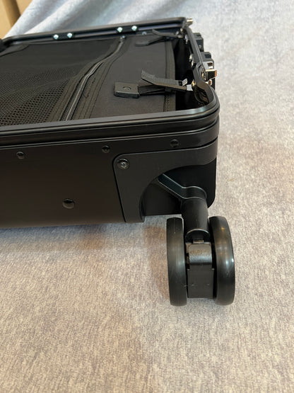Dual wheel luggage castor assembly for 4-wheel stand up roll aboards.