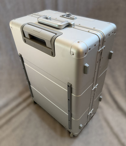 Paradox Aviation 25-inch GEN2 silver hard-shell flight crew roll aboard suitcase with matte grey handle and wheels.