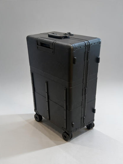 Paradox Aviation 30-inch GEN2 Frequent Flyer check-in luggage in matte black with four wheels and reinforced corners.