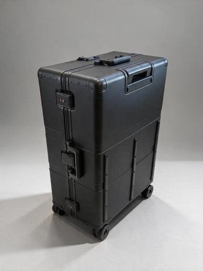 Paradox Aviation 30-inch GEN2 Frequent Flyer check-in luggage in matte black with four wheels and reinforced frame.