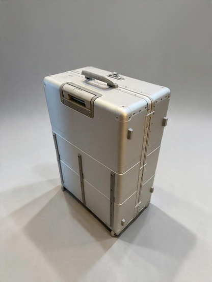 Paradox Aviation 30-inch GEN2 silver metal check-in luggage with four wheels, retractable handle, and cargo tracks.