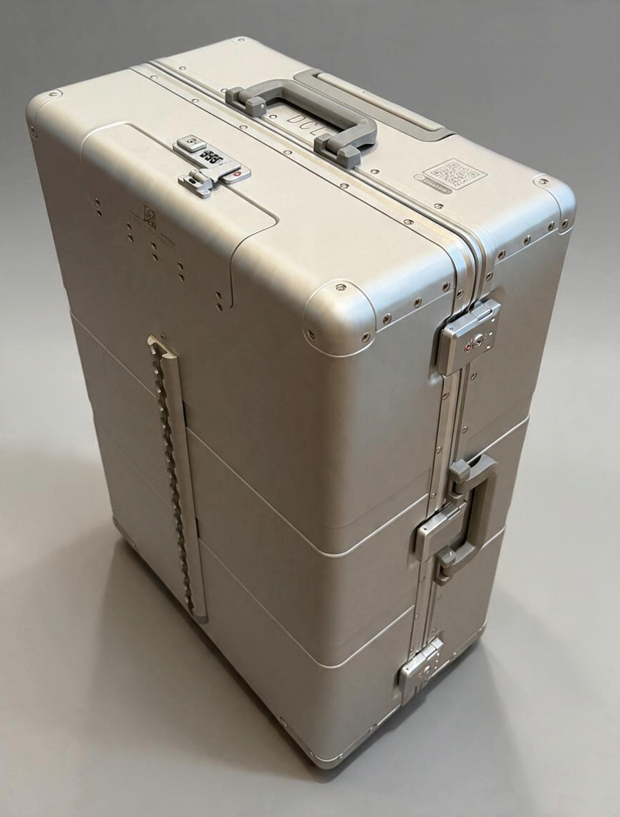 Paradox Aviation 30-inch GEN2 silver metal check-in luggage with reinforced corners, combination lock, and side handle.