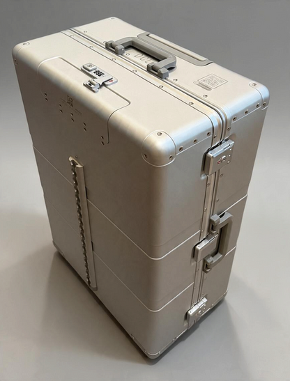 Paradox Aviation 30-inch GEN2 silver metal check-in luggage with reinforced corners, combination lock, and side handle.