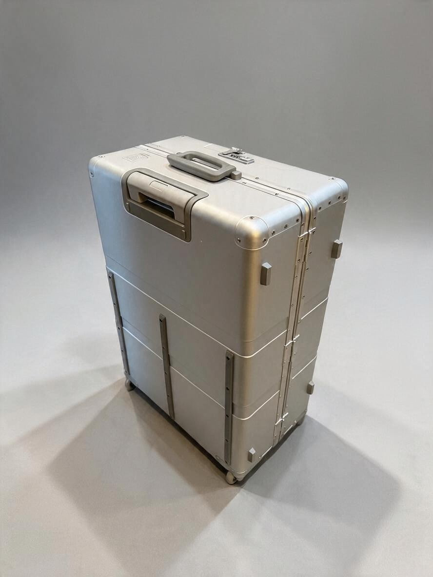 Paradox Aviation 30-inch GEN2 Frequent Flyer check-in luggage in starlight silver with matte grey handle and wheels.