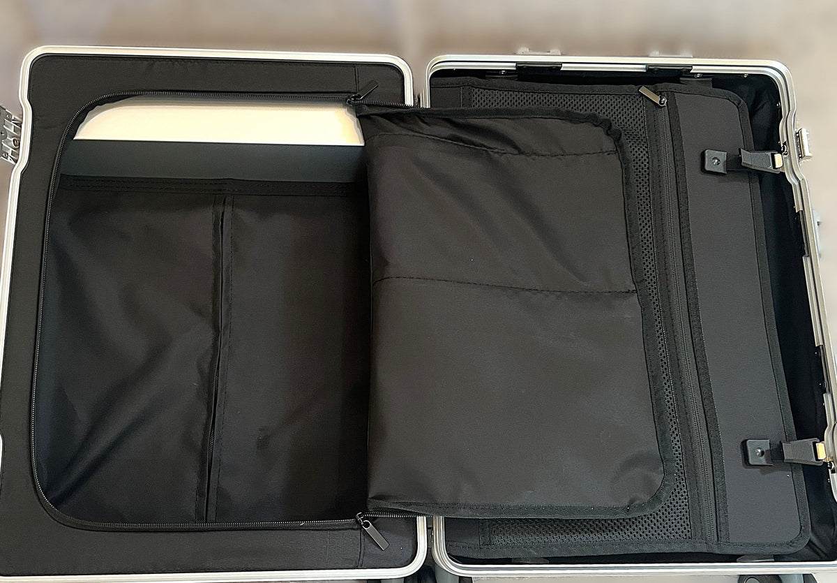 Interior of Paradox Aviation GEN2 Frequent Flyer carry-on suitcase featuring a black wet clothes pouch and dividers.