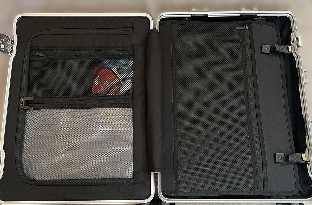 Interior of Paradox Aviation GEN2 Frequent Flyer carry-on suitcase featuring black mesh storage and wet clothes pouch