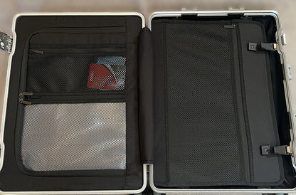 Interior of Paradox Aviation GEN2 Frequent Flyer carry-on suitcase featuring black mesh storage and wet clothes pouch