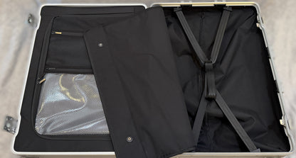 Open interior of a Paradox Aviation 25 inch GEN2 Frequent Flyer luggage case featuring a wet clothes pouch and straps