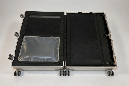 Interior view of Paradox Aviation 30-inch GEN2 Frequent Flyer suitcase featuring black mesh dividers and wet pouch.