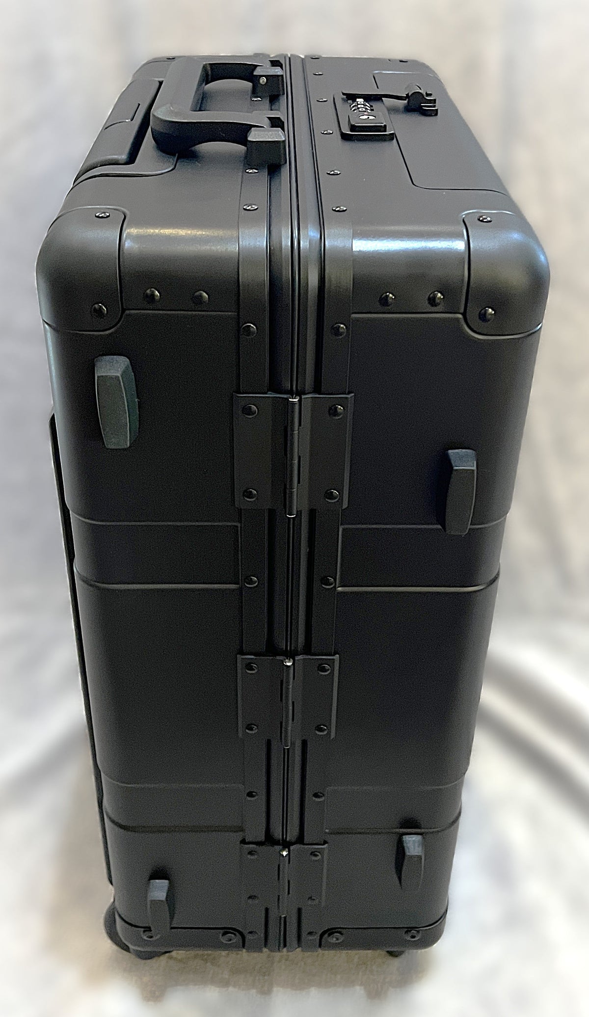 Paradox Aviation GEN2 22-inch professional flight crew roll aboard suitcase in matte black aluminum with sturdy hinges.