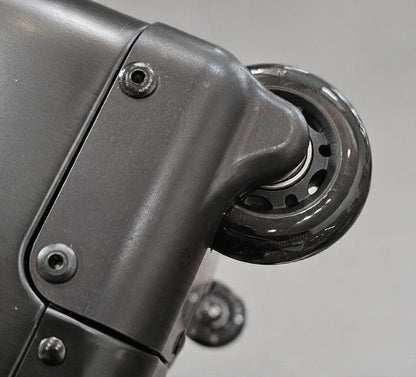 Close-up of the durable matte grey wheel assembly on a Paradox Aviation GEN2 professional flight crew check-in case.