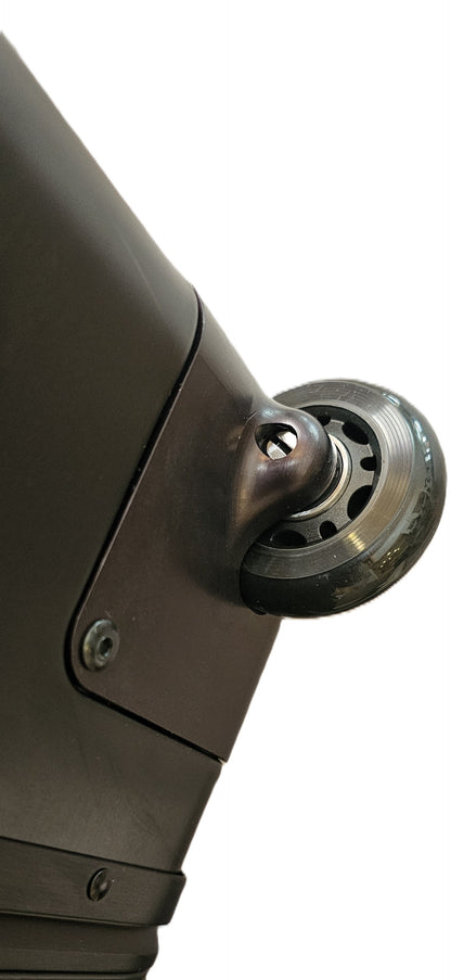 Close-up of the durable matte grey wheel on a Paradox Aviation GEN2 professional flight crew roll aboard suitcase.