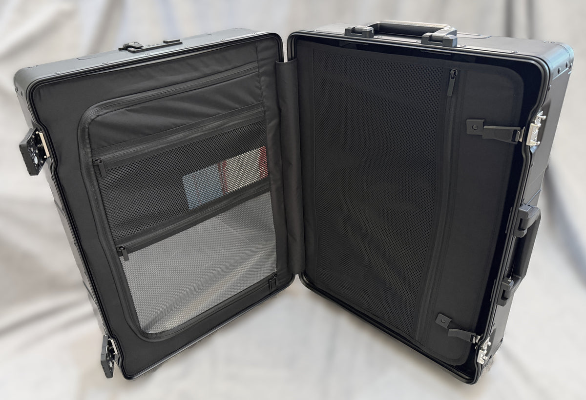 Open interior of a Paradox Aviation 25-inch GEN2 flight crew roll aboard case with black mesh storage compartments.