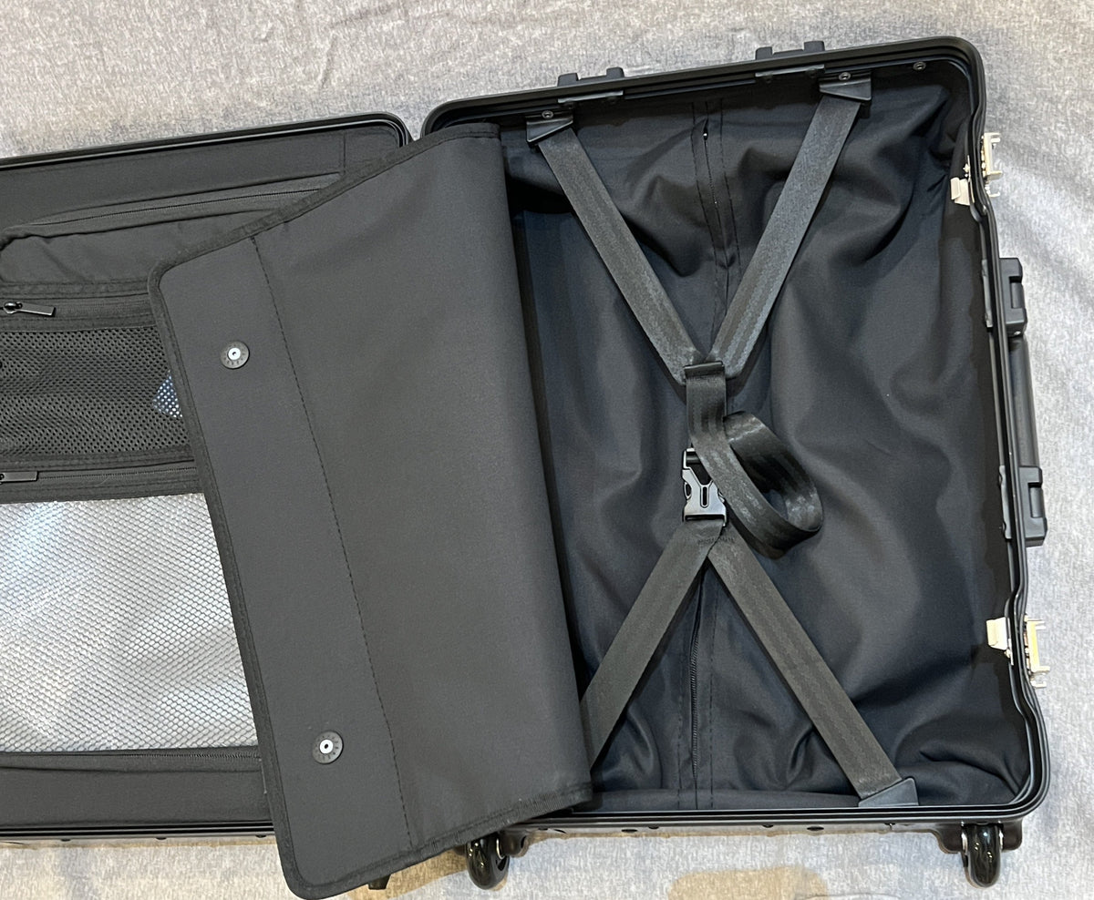Interior of Paradox Aviation GEN2 22-inch professional flight crew roll aboard case with black lining and straps.
