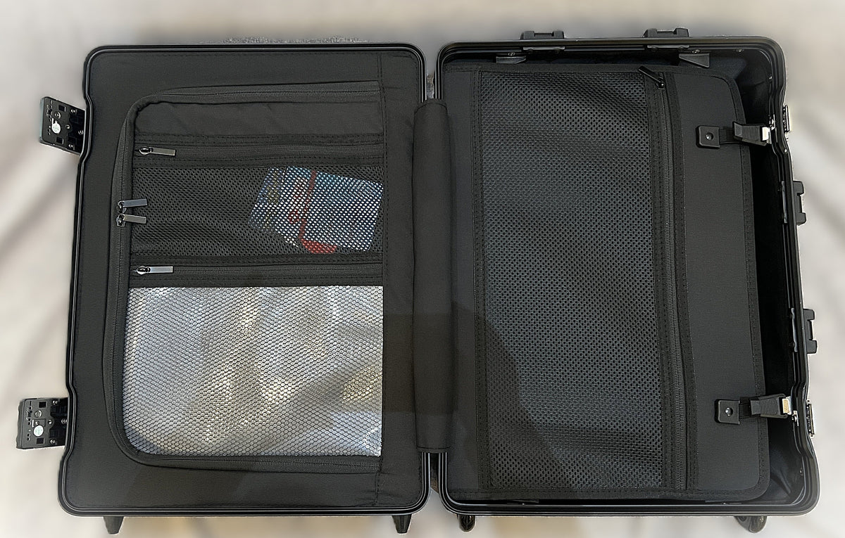 Open interior of Paradox Aviation 22-inch GEN2 flight crew roll aboard featuring black mesh pockets and wet bag.