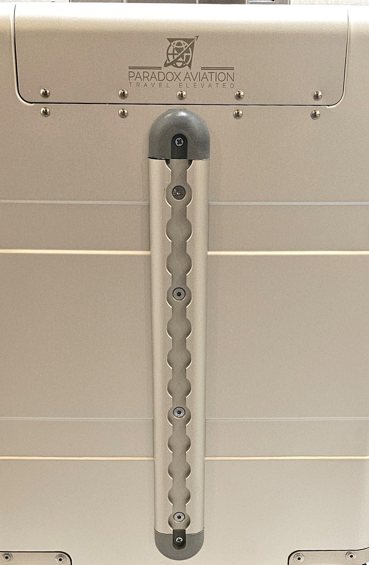Paradox Aviation GEN2 silver aluminum carry-on luggage featuring a front cargo track and branded logo plate.