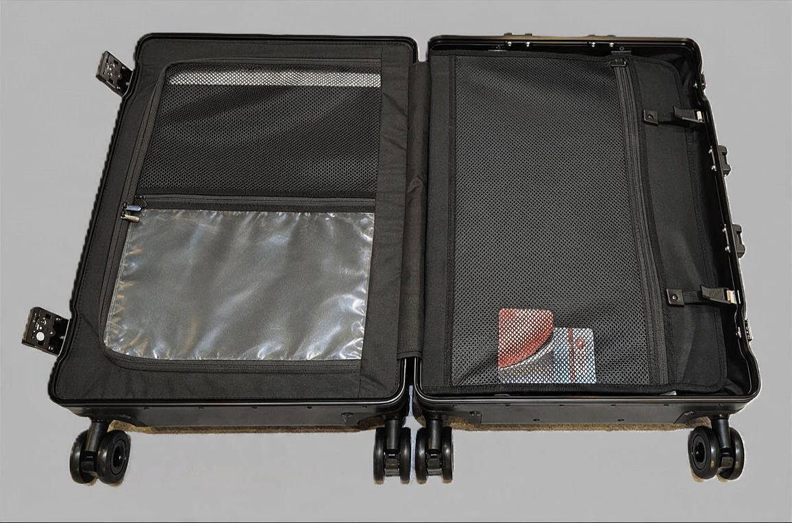 Interior view of Paradox Aviation 30-inch GEN2 flight crew luggage showing mesh pockets and a wet clothes pouch.