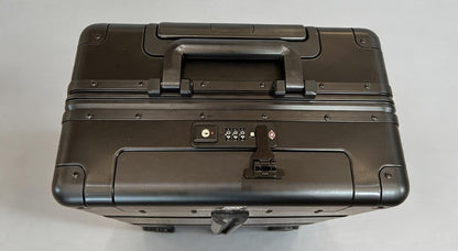 Top view of a black Paradox Aviation GEN2 professional flight crew check-aboard luggage with a TSA combination lock.