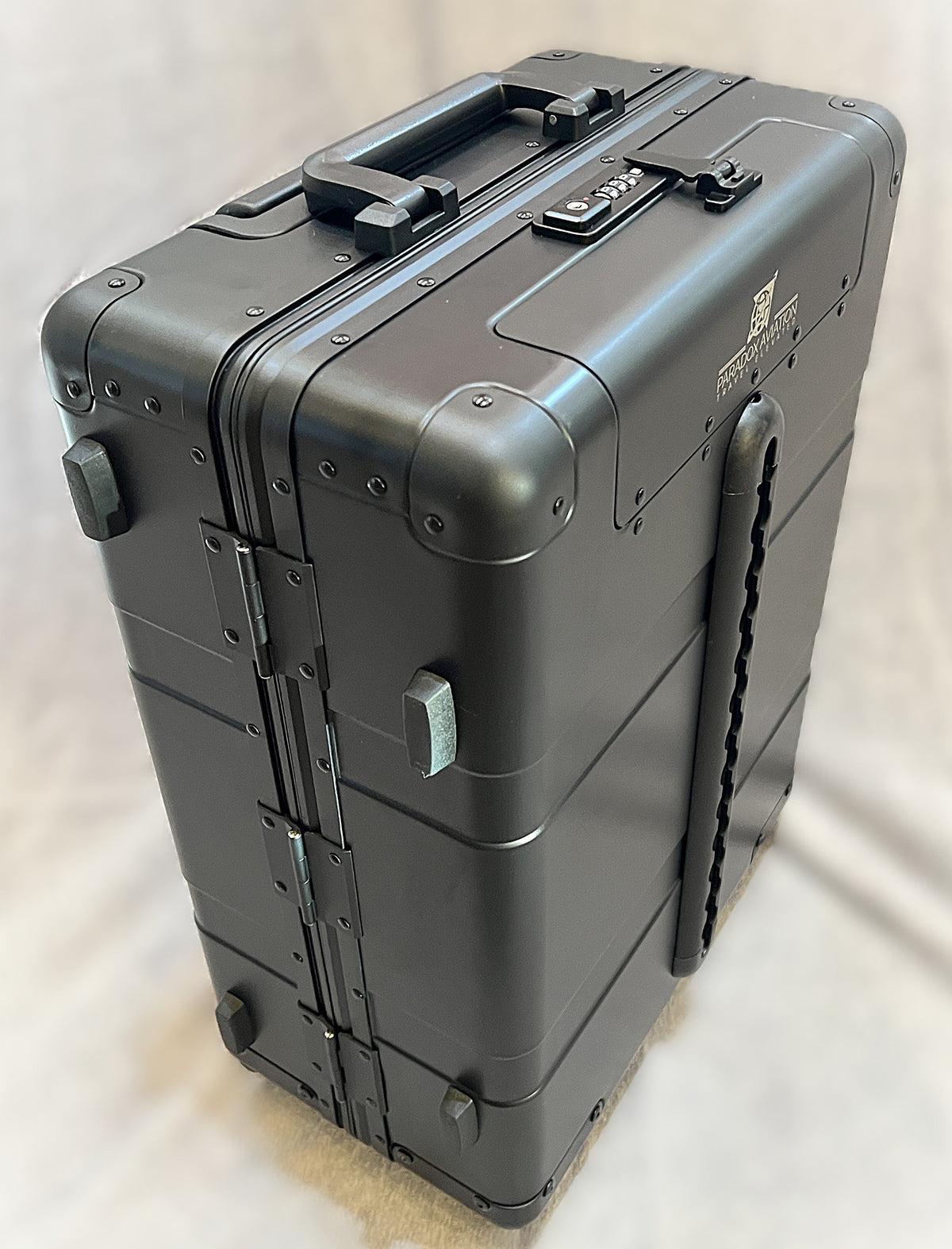 Paradox Aviation 22-inch GEN2 professional flight crew roll aboard suitcase in matte black aluminum with cargo track.