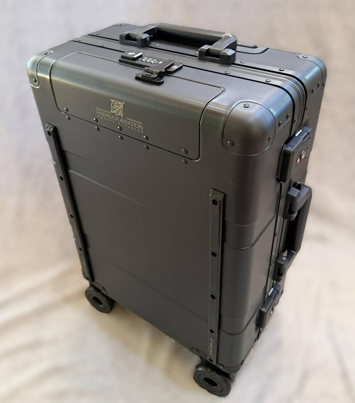 Paradox Aviation 22-inch GEN2 Frequent Flyer hard-shell carry-on suitcase in dark sky matte black with four wheels.