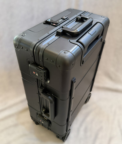 Paradox Aviation 22-inch GEN2 Frequent Flyer carry-on suitcase in dark sky matte black metal with four wheels and TSA lock.