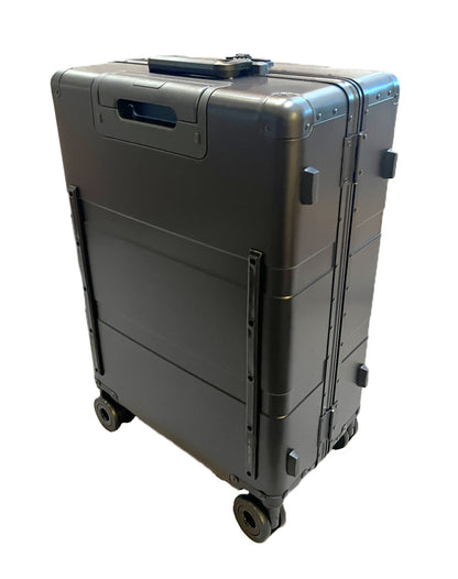 Paradox Aviation 25-inch GEN2 Frequent Flyer aluminum hard-shell roll aboard luggage in dark grey with four wheels.