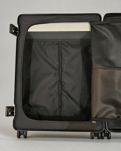 Interior of Paradox Aviation GEN2 30-inch check-in luggage featuring a black fabric lining and mesh storage pouch.