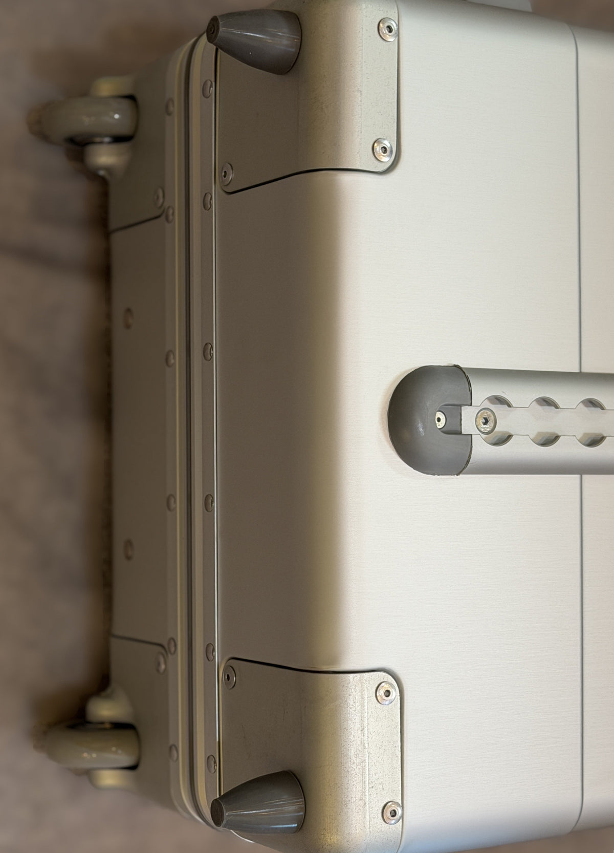 Paradox Aviation GEN2 22-inch silver aluminum flight crew roll aboard suitcase with reinforced corners and wheels.