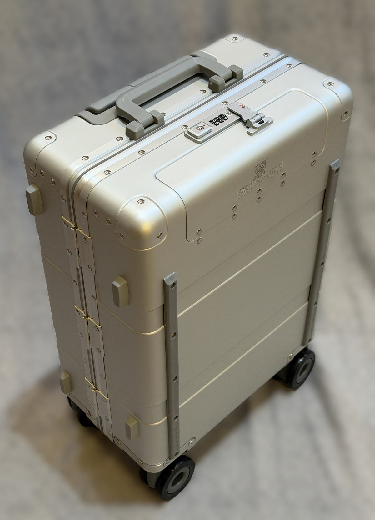 Paradox Aviation 22-inch GEN2 Frequent Flyer carry-on suitcase in starlight matte silver with matte grey handle and wheels.