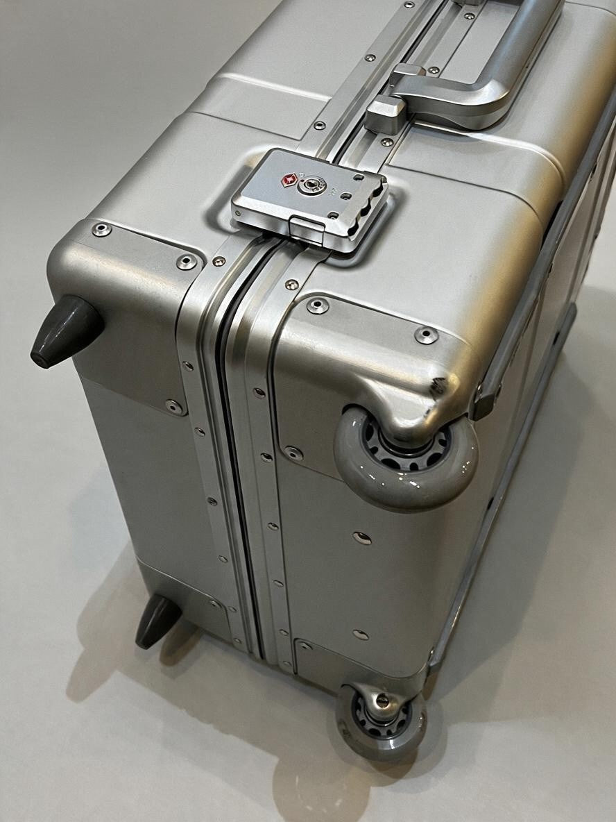 Paradox Aviation 30 inch GEN2 silver hard-shell flight crew luggage with matte grey wheels and TSA lock.