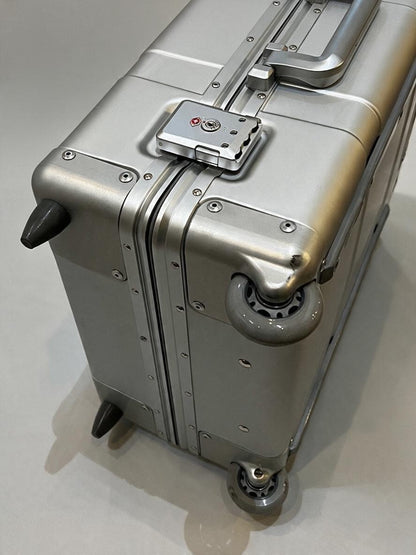Paradox Aviation 30 inch GEN2 silver hard-shell flight crew luggage with matte grey wheels and TSA lock.