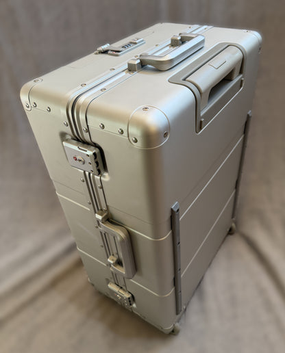 Paradox Aviation 25-inch GEN2 silver aluminum flight crew roll aboard luggage with reinforced corners and two wheels.