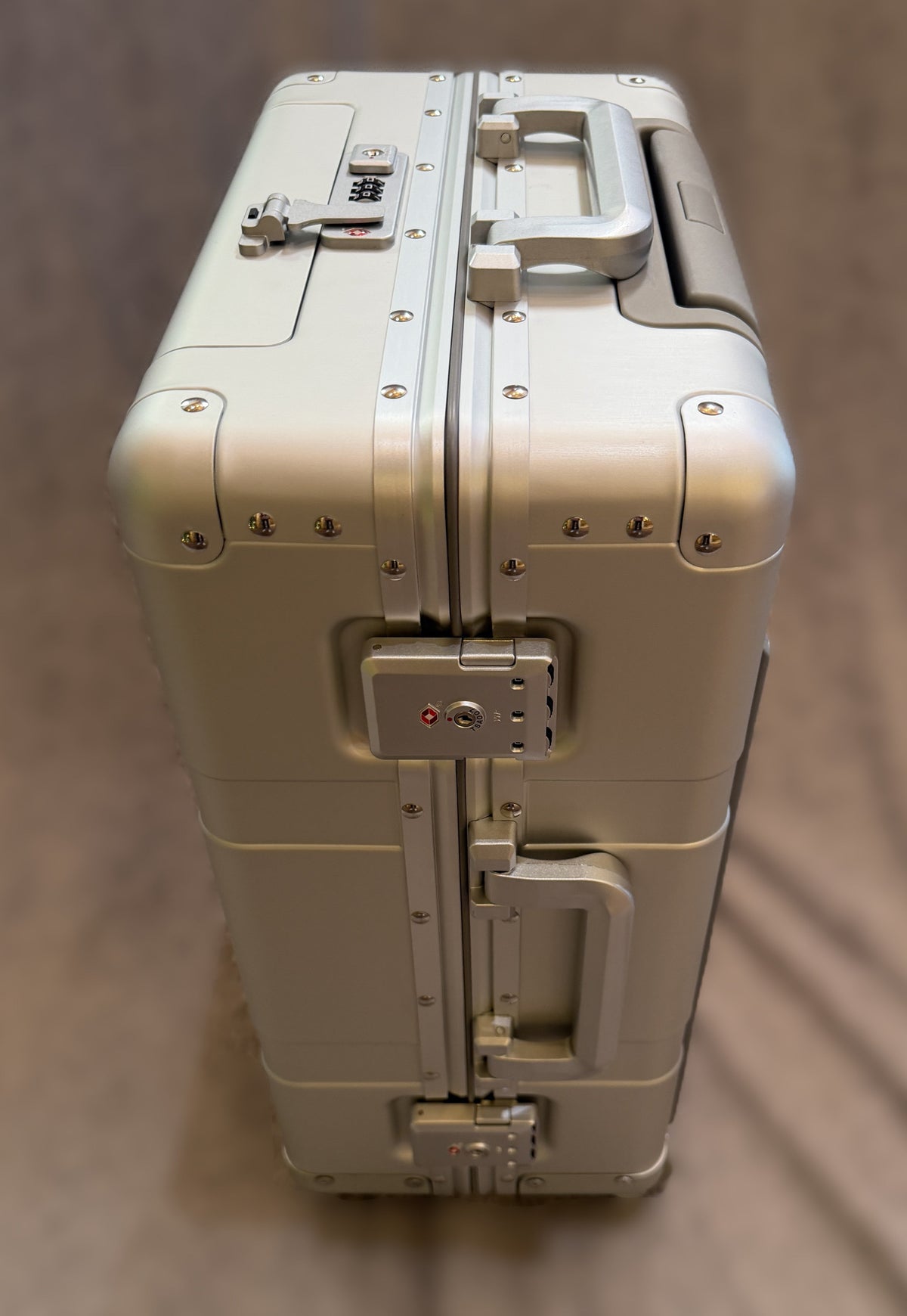 Paradox Aviation GEN2 22-inch silver aluminum flight crew roll aboard suitcase with reinforced hinges and TSA locks.