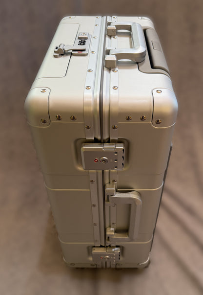 Paradox Aviation GEN2 22-inch silver aluminum flight crew roll aboard suitcase with reinforced hinges and TSA locks.