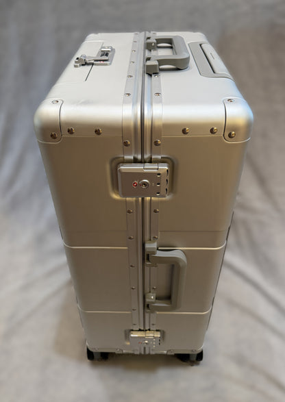 Paradox Aviation GEN2 25-inch Frequent Flyer aluminum hard-shell roll aboard luggage in starlight silver with matte grey handles.