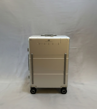 Paradox Aviation 25-inch GEN2 Frequent Flyer aluminum hard-shell roll aboard luggage in starlight silver with matte grey wheels.