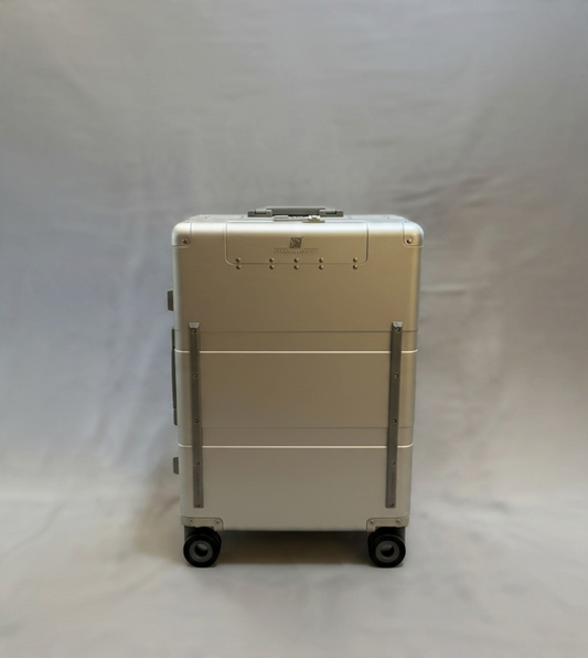 Paradox Aviation 25-inch GEN2 Frequent Flyer aluminum hard-shell roll aboard luggage in starlight silver with matte grey wheels.